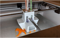 3D printer printing a cat figure